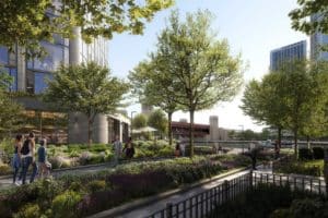 A rendering of the new Related Midwest project in Chicago showing people walking through a renovated park area 