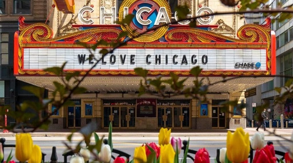Exterior of the Chicago Theater with tulips outside