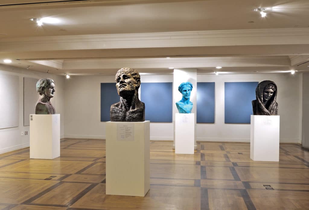 Sculptor George Petrides with works from his Hellenic Heads exhibition