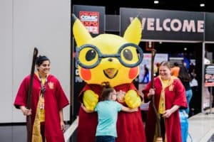 Pikachu blow up toy pictured with people dressed up in costume