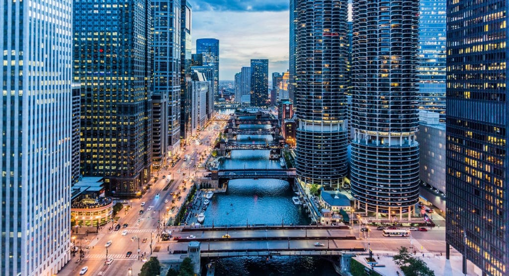 Image showing a view of the Chicago River with bridges, cars and people on a busy evening