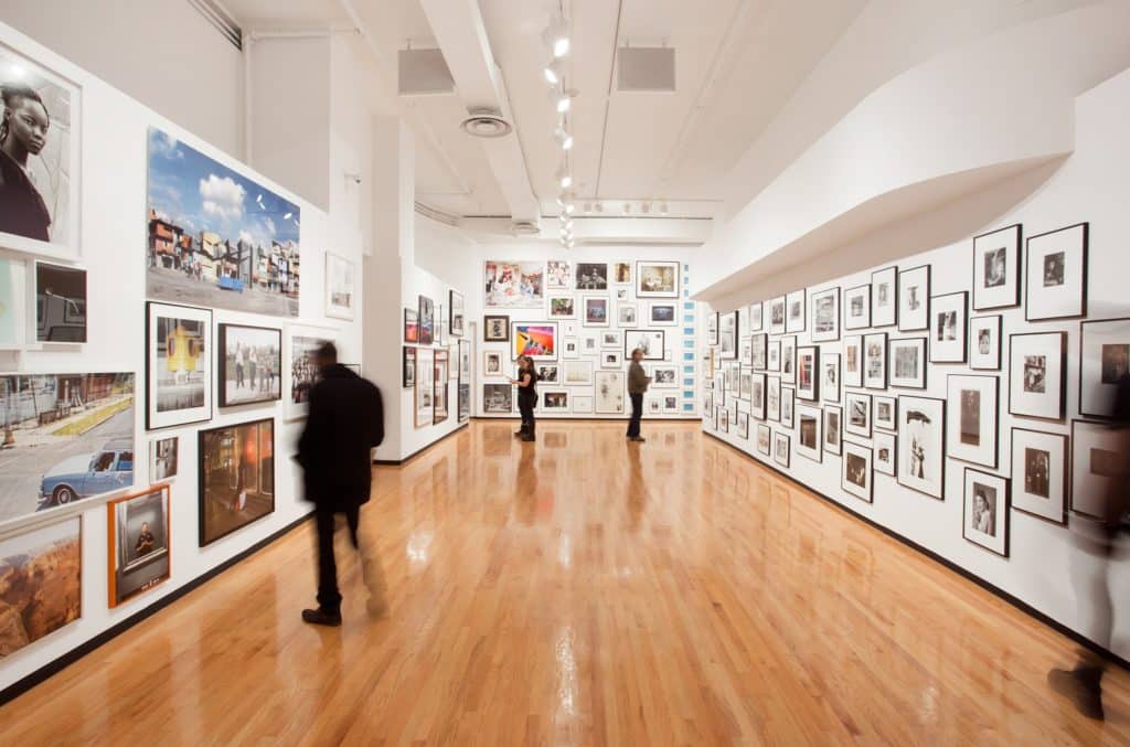 a room with photographs covering the walls at the Museum of Contemporary Photography in Chicago