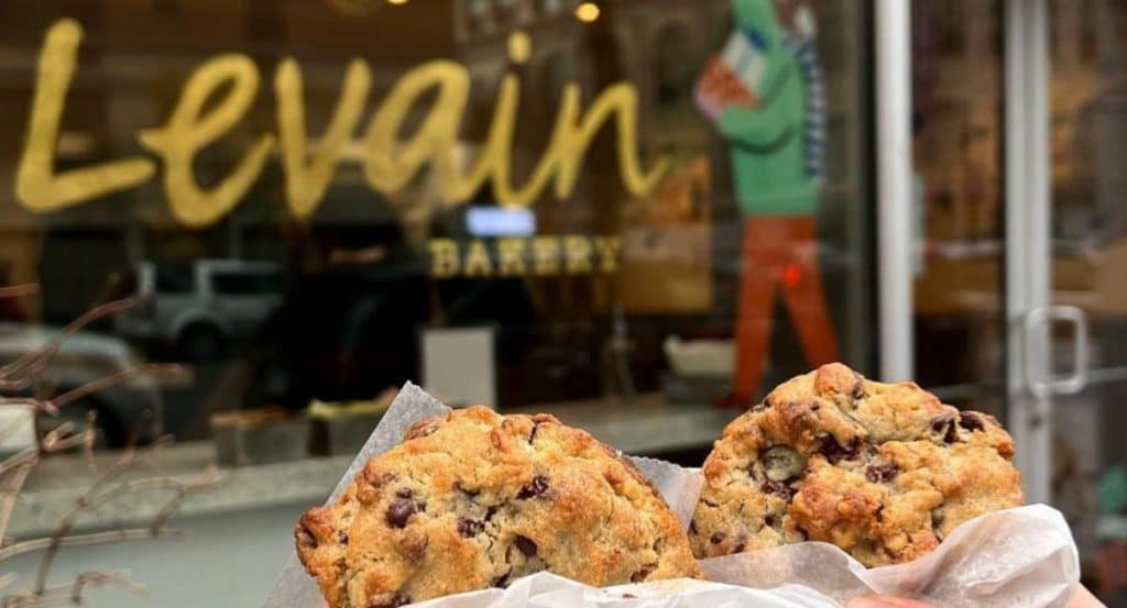 Levain cookies with storefront in background