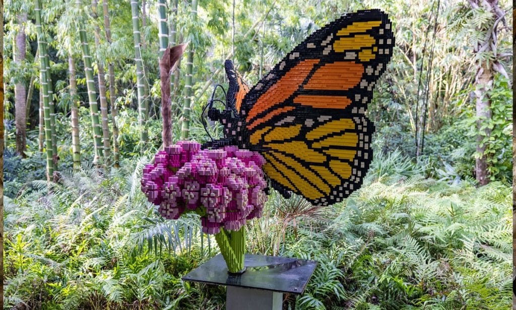 Lego design of a butterfly on a flower