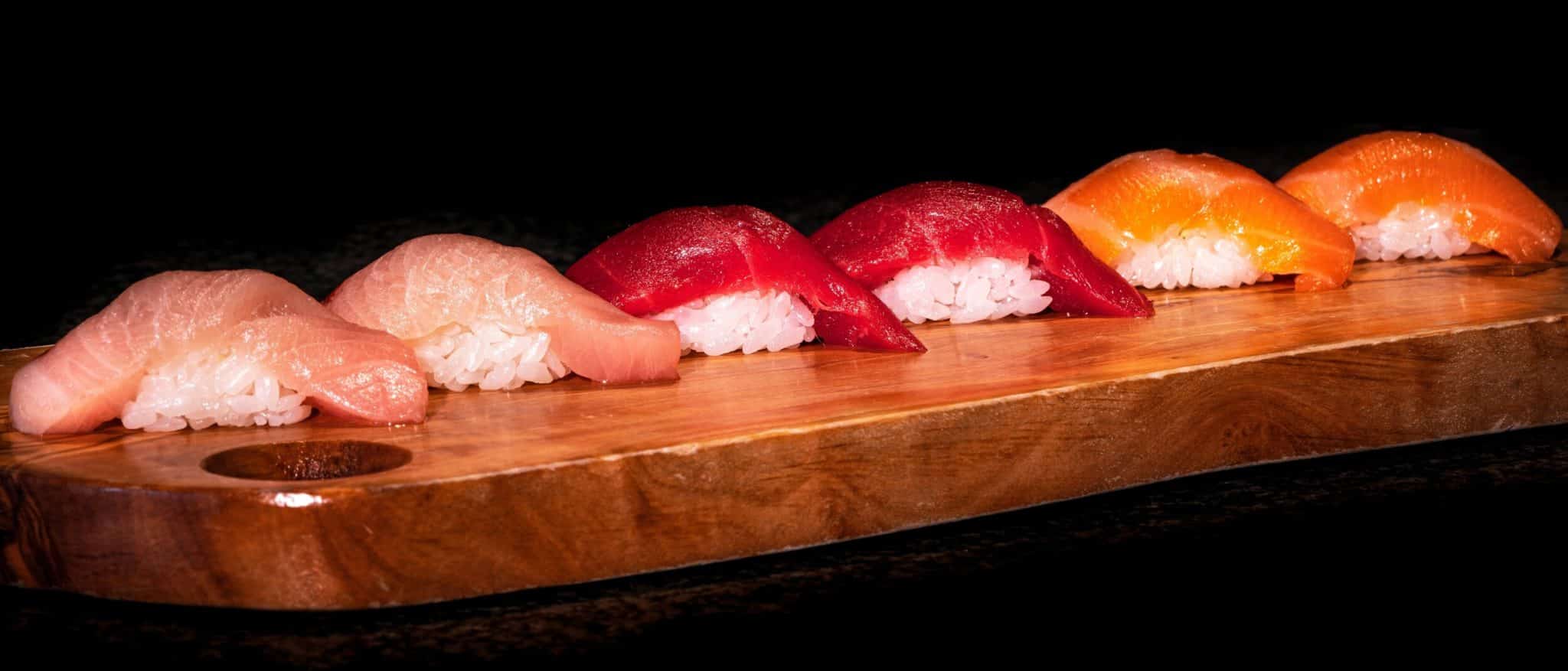 tune salmon nigiri sushi on a platter from tanoshii sushi chicago