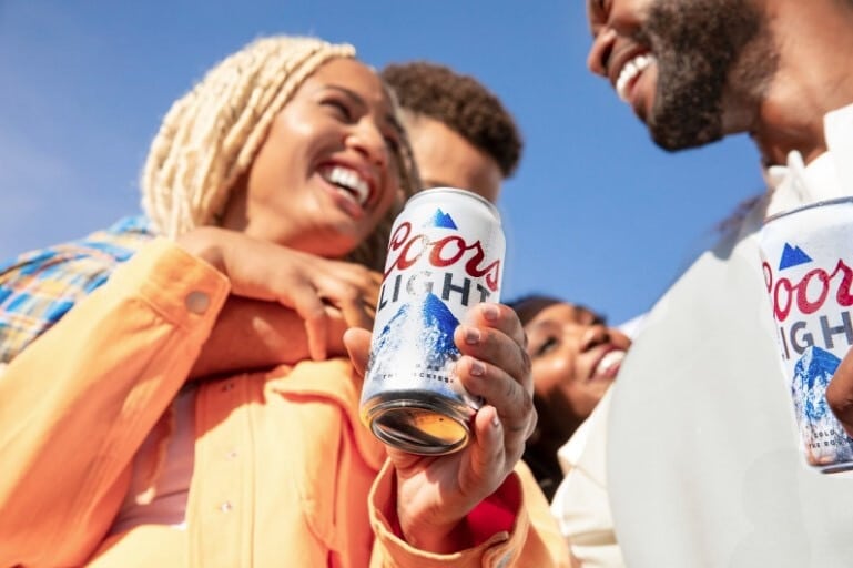 Photo of people holding Coors light 