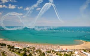 Image showing crowds on North Avenue Beach in Chicago watching aircrafts performing in the sky for the Chicago Air & Water Show.