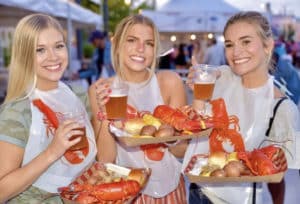 Image showing three girls with food and drinks from the Great American Lobster Fest in Chicago