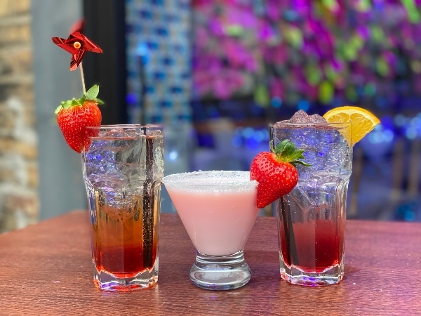 Three mixed drinks served at the bar