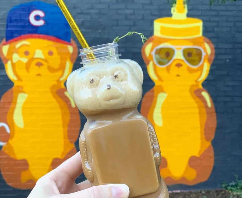 Honey bear latte against mural