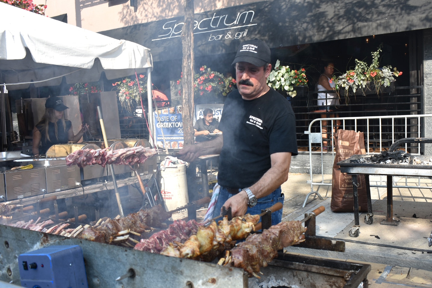 Person cooking gyro on a grill