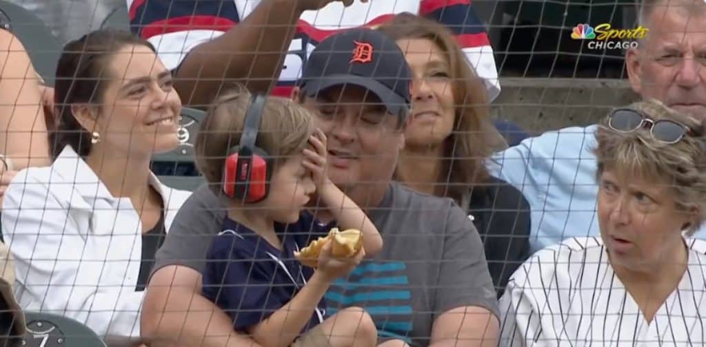 Photo of a young kid face palming at a White Sox game