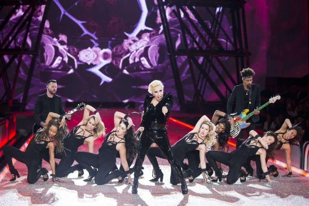 Lady Gaga performing on stage with dancers
