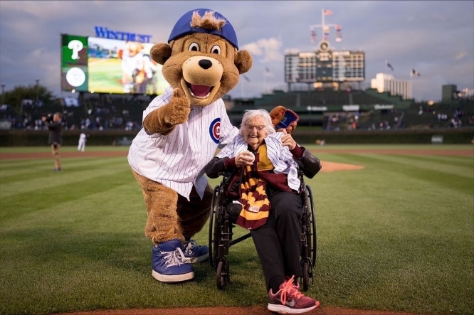 Sister Jean posing with the Cubs mascot 