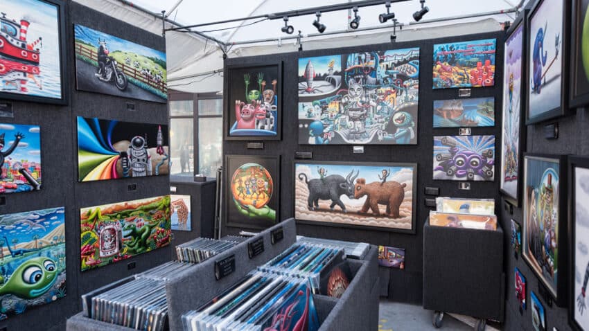 Art vendor shows paintings at west loop art fest