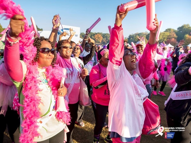 People seen participating in a Making Strides Against Breast Cancer walk