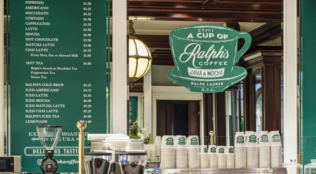 Ralph's coffee bar with green accents and a marble coffee counter