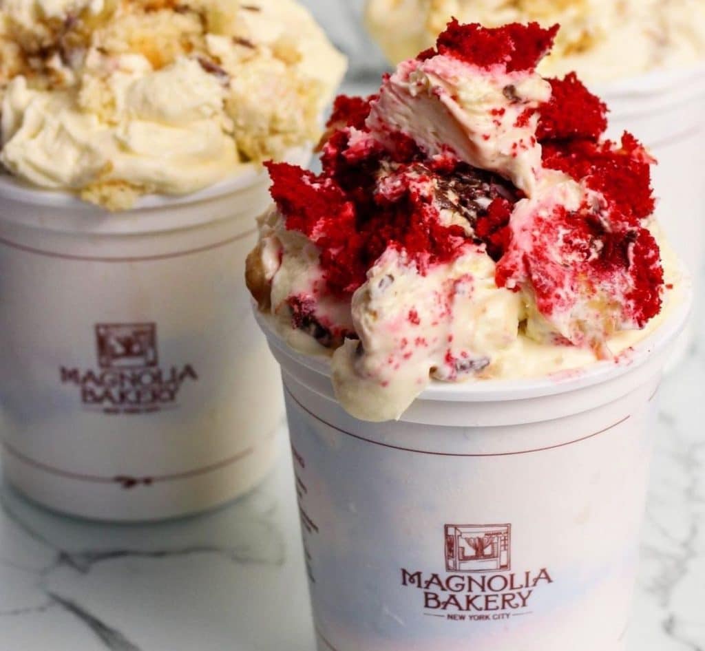 Magnolia Bakery red velvet banana pudding with an original pudding seen to the left
