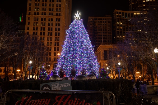 A 55-foot Christmas tree seen in downtown Chicago glowing in bright lights