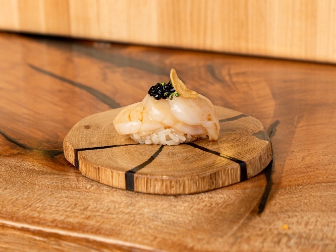 Sushi seen on a wooden platter