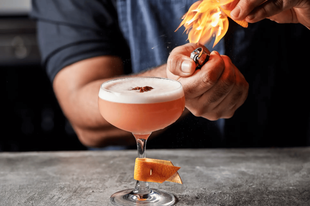 Cocktail glass with fire pictured