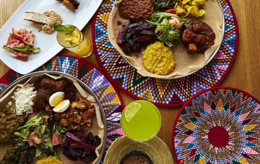 Plates of food pictured on colorful placemats