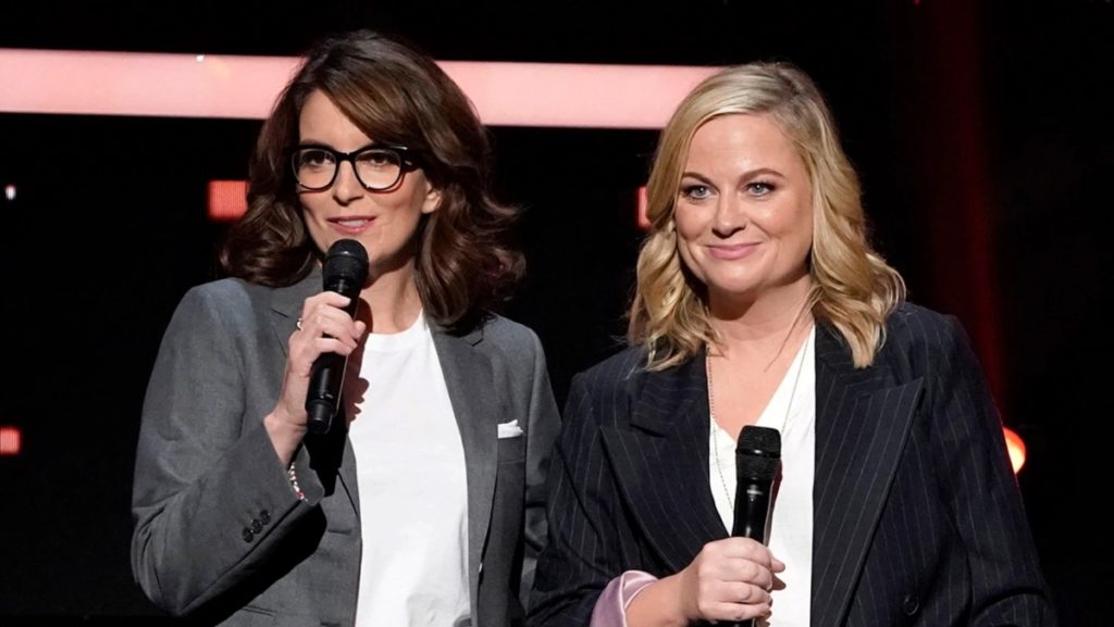 Tina Fey and Amy Poehler speaking on stage