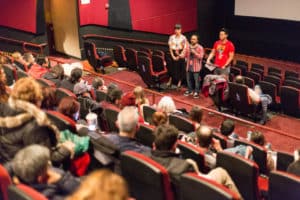Audience pictured at the Chicago Latino Film Festival sitting in theater seats