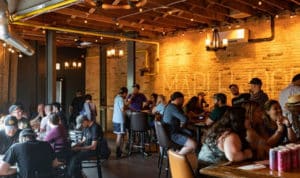 Image showing people gathered drinking craft beer at Maplewood taproom in Chicago