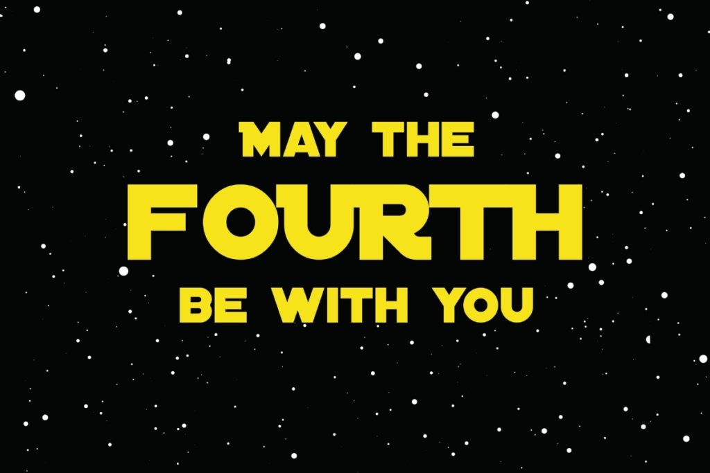 A sign reading May the Fourth Be With You in Star Wars font