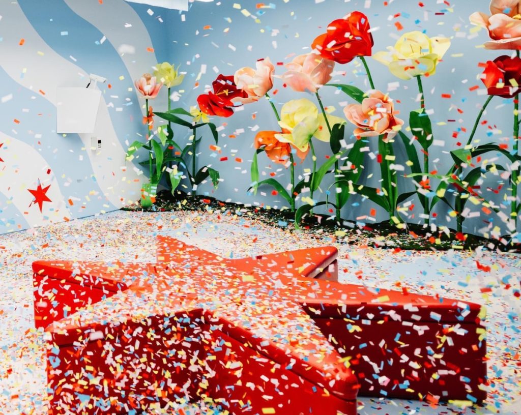 Chicago's confetti room featuring spring flower installation and colorful confetti