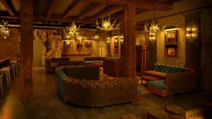 The back lounge at Bodega Taqueria y Tequila features moody lighting, cozy couches, a bar in the back and wood accents.