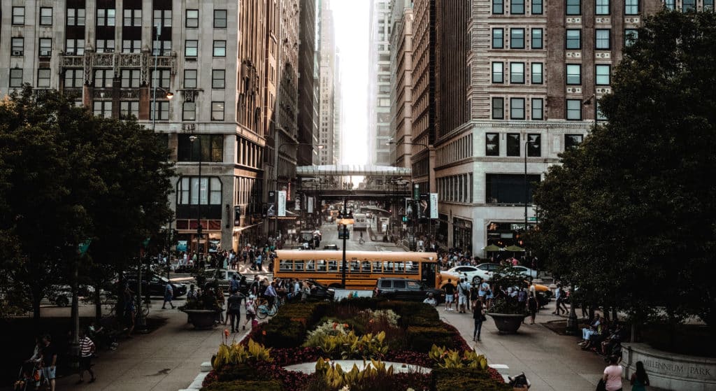 Image showing a street in Chicago with buildings, buses, cars and a train of the Chicago Transit Authority