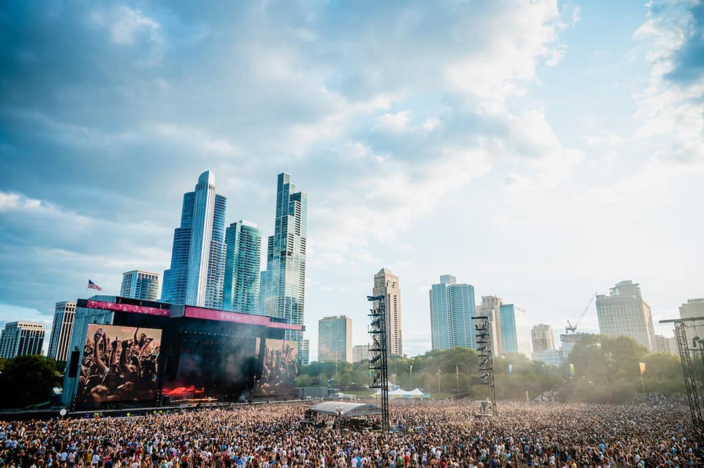 thousands gathered under the city skyline at grant park during lollapalooza