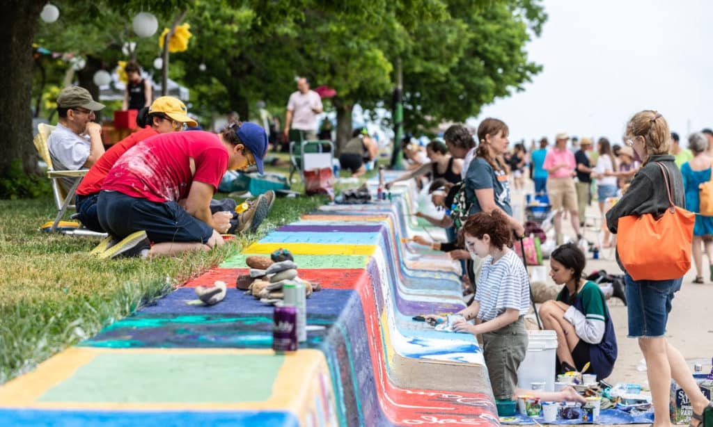 Image showing artists painting the seawall at Loyola Beach in Rogers Park, Chicago for the annual Artists of the Wall festival