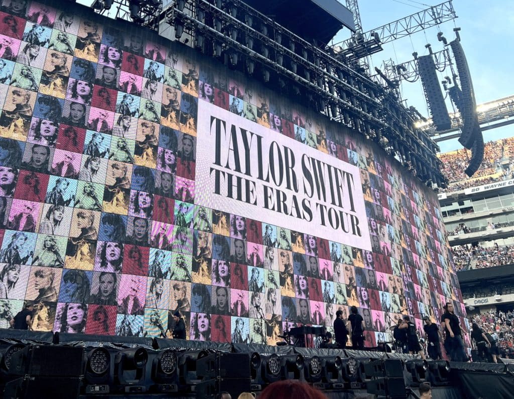 The Eras Tour stage setup featuring Taylor Swift The Eras Tour logo on screen