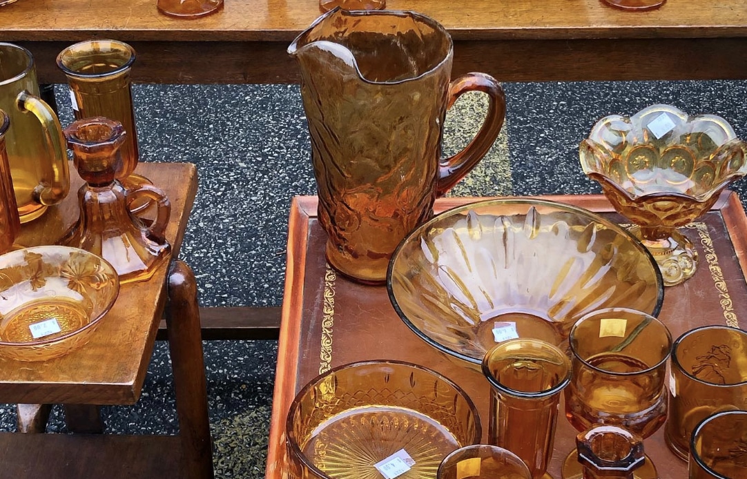 brown tinted pitcher, bowl, and glasses on a wooden table from Mt. Sinai Resale Shop in Chicago