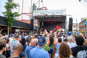 Image showing people watching live music on the main stage at Taste of Lincoln Avenue in Chicago
