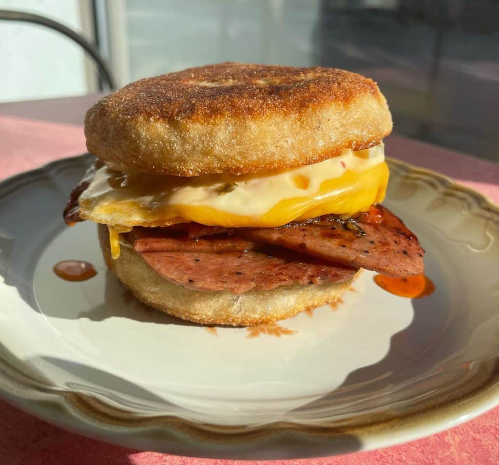  House made mortadella, fried egg, American cheese, pepper jelly, roasted olive mayo all on a fresh English muffin