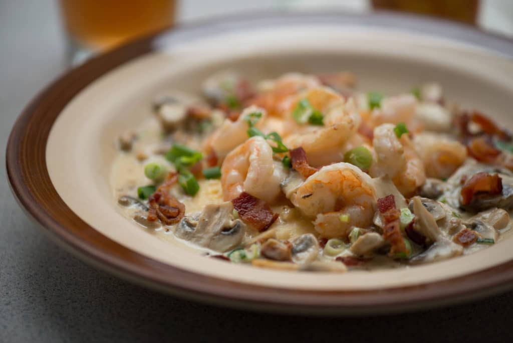 shrimp and grits with bacon bits and garnish in a bowl breakfast from Wishbone in Chicago