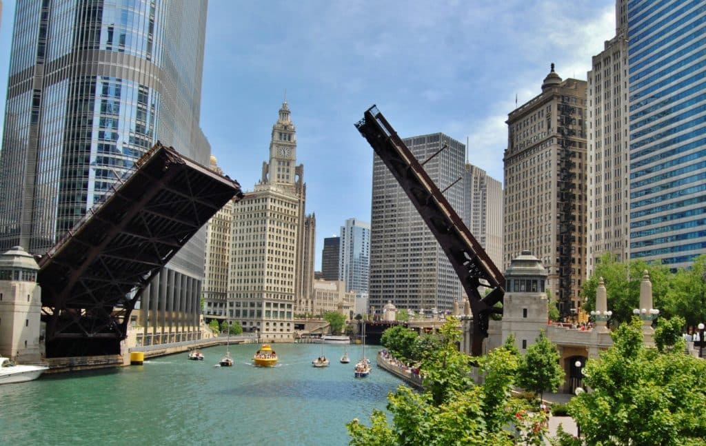 Image showing a bridge raised on the Chicago River with boats and Chicago architecture visible in the background
