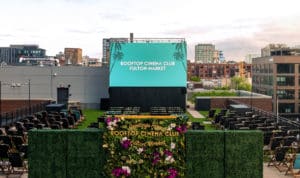 Image showing a large screen for watching movies and the Rooftop Cinema Club set up on the terrace of the Emily Hotel in Chicago