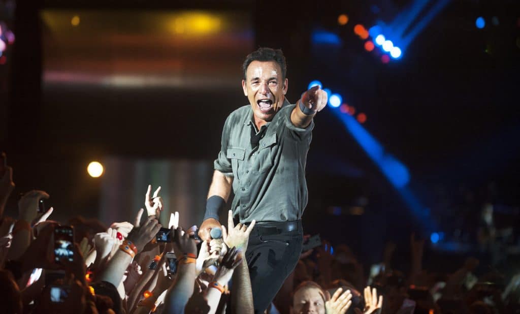 singer Bruce Springsteen performs among the audience during the Rock in Rio 2013 concert , on September 21, 2013, in Rio de Janeiro, Brazil.