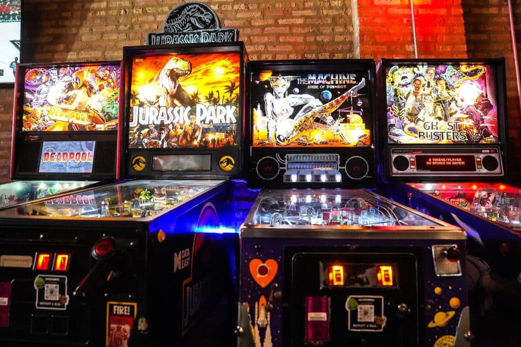 four lit up pinball games in a row at emporium in Chicago