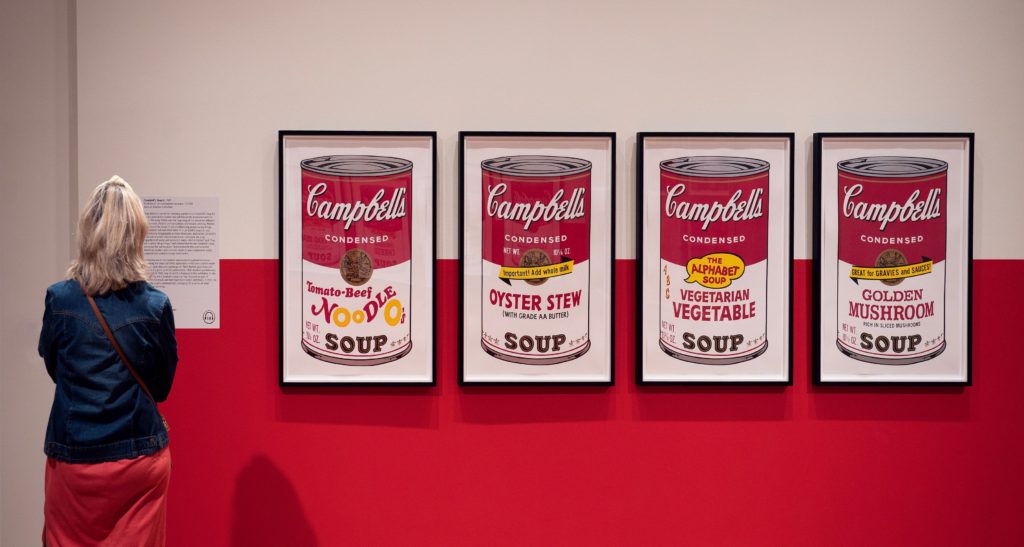 a person looking at Warhol's Campbell soup, A Life in Pop exhibition at the Cleve Carney Museum of Art