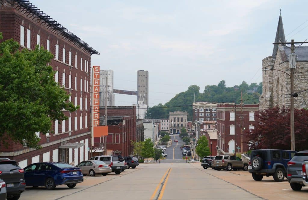 Views of the city of Alton, Illinois with buildings and a bridge in the background