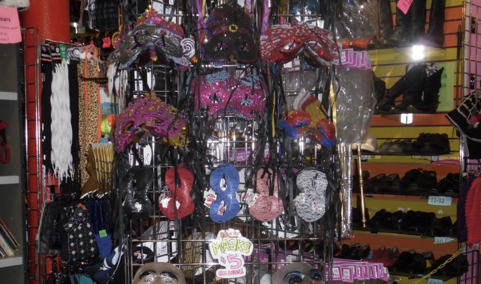eye masks, face mask, and hats hung up on a rack at beatnix in Chicago