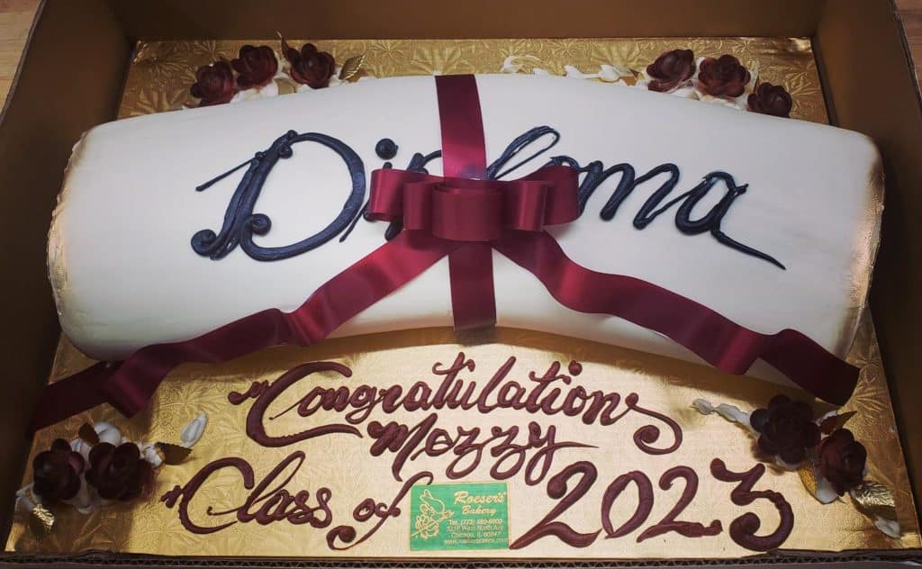 diploma with red ribbon yellow cake from Roeser's bakery in chicago