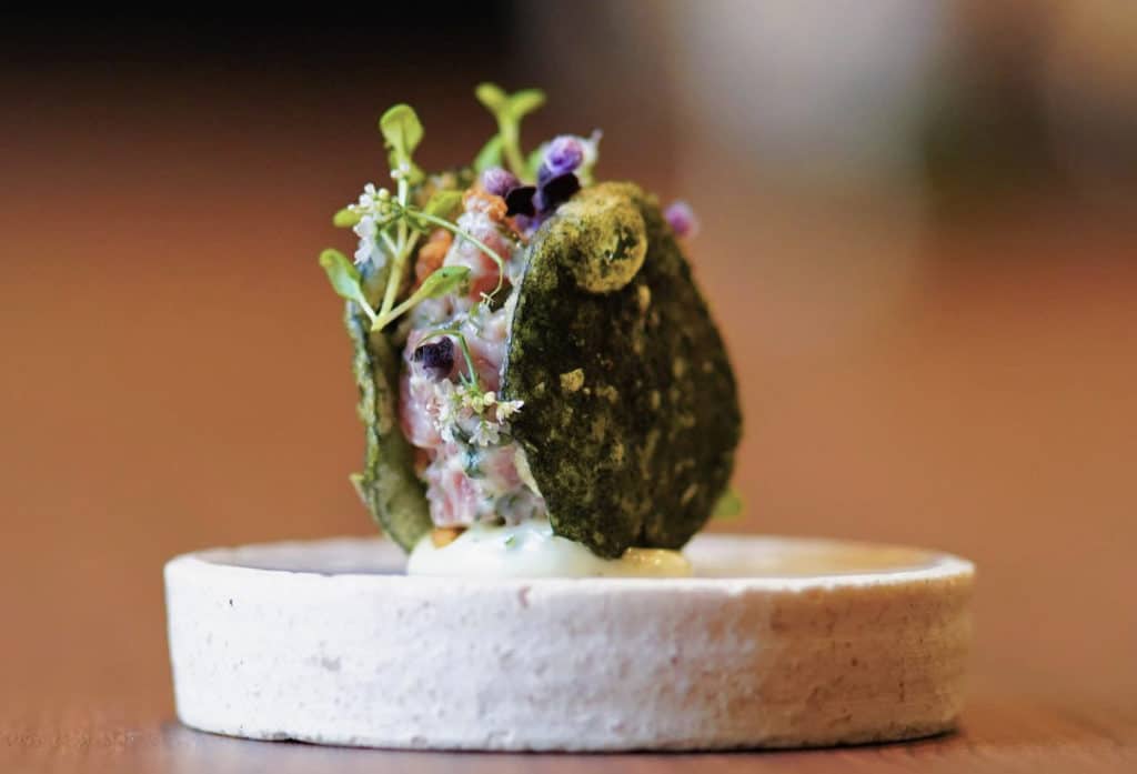  A5 Miyazaki Wagyu tartare with smoked oyster aioli between two tempura shiso leaves from oriole, one of the best Michelin-starred restaurants in Chicago 